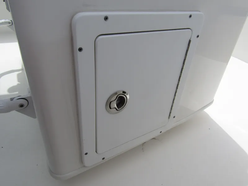 Slide: The Image of 2021 Tidewater 2700 Carolina Bay storage compartment with secure latch. - 34