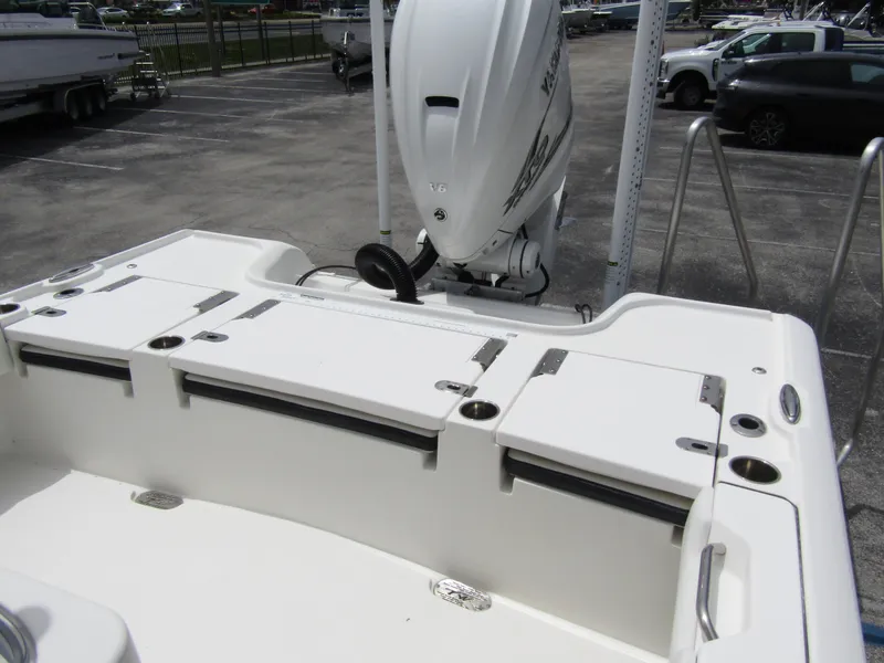 Slide: The Image of 2021 Tidewater 2700 Carolina Bay boat with outboard motor in parking lot. - 36