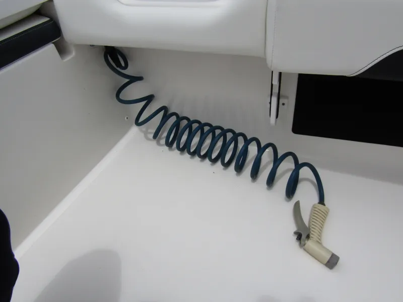 Slide: The Image of Coiled hose and nozzle on 2021 Tidewater 2700 Carolina Bay boat deck. - 39