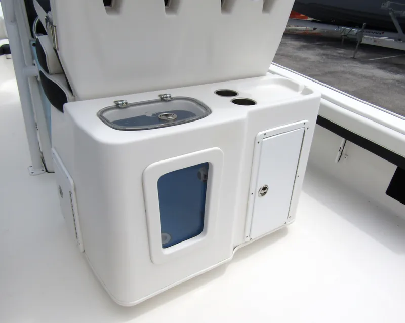 Slide: The Image of 2021 Tidewater 2700 Carolina Bay boat console with storage and cup holders. - 40