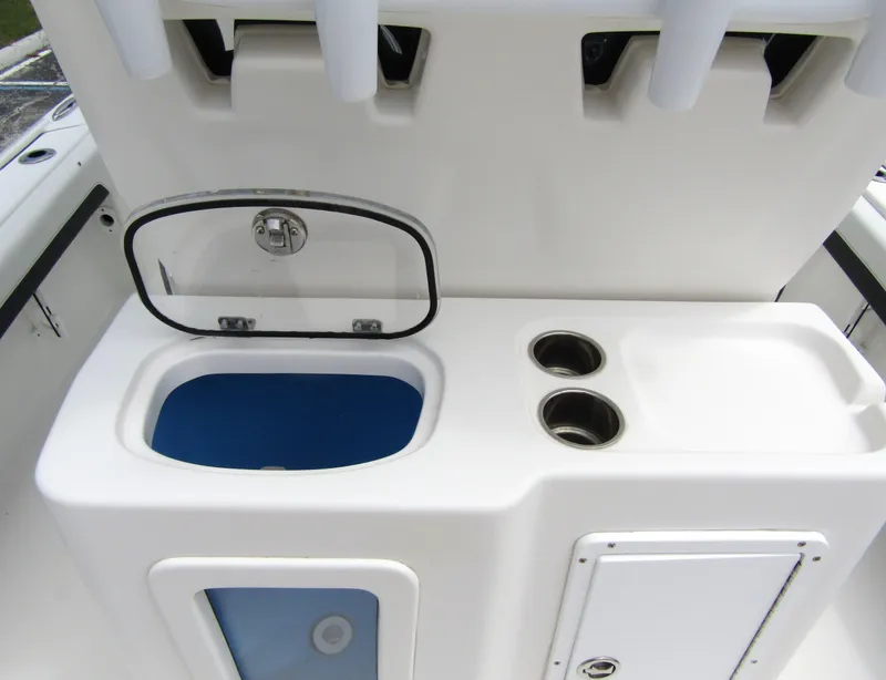 Slide: The Image of 2021 Tidewater 2700 Carolina Bay boat console with storage and cup holders. - 41