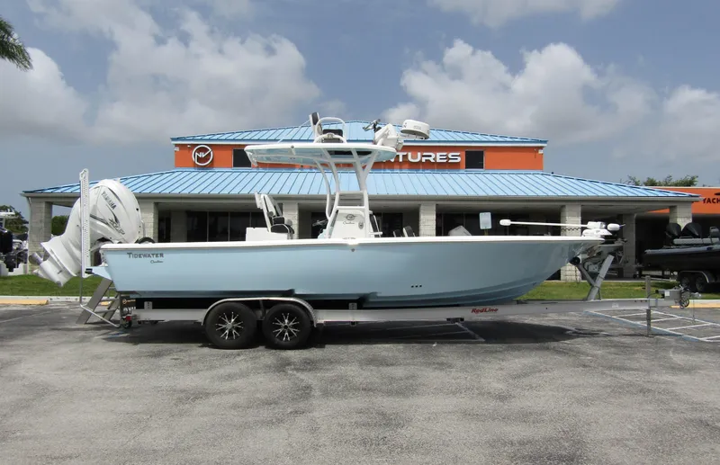 Slide: The Image of 2021 Tidewater 2700 Carolina Bay boat on trailer, parked outside dealership. - 5