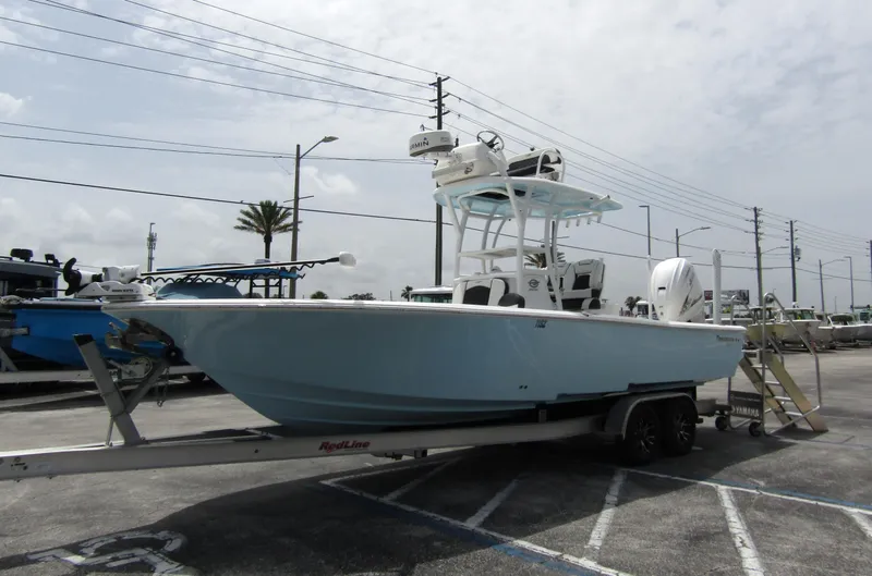 Slide: The Image of 2021 Tidewater 2700 Carolina Bay boat on trailer in parking lot. - 7