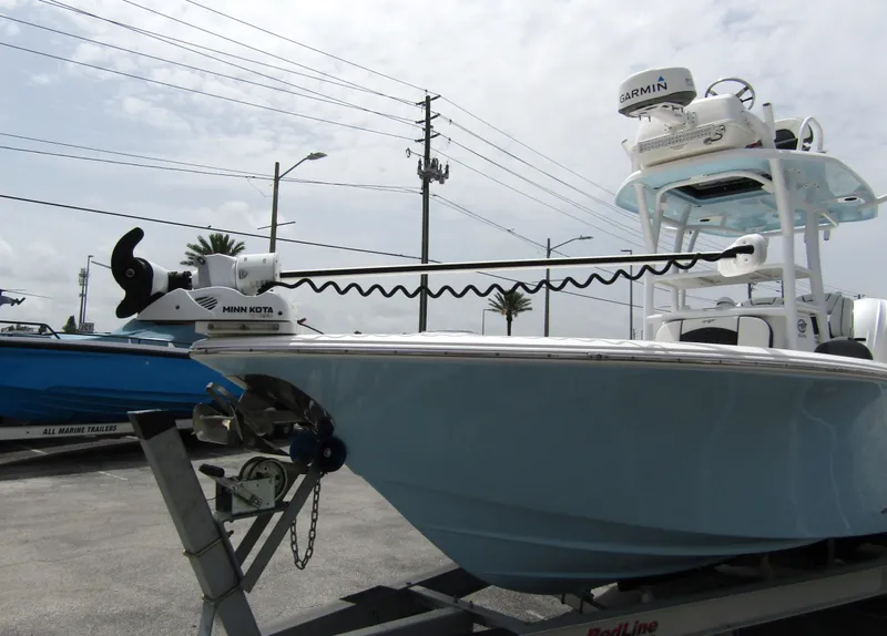 Slide: The Image of 2021 Tidewater 2700 Carolina Bay boat on trailer, featuring Garmin equipment. - 8