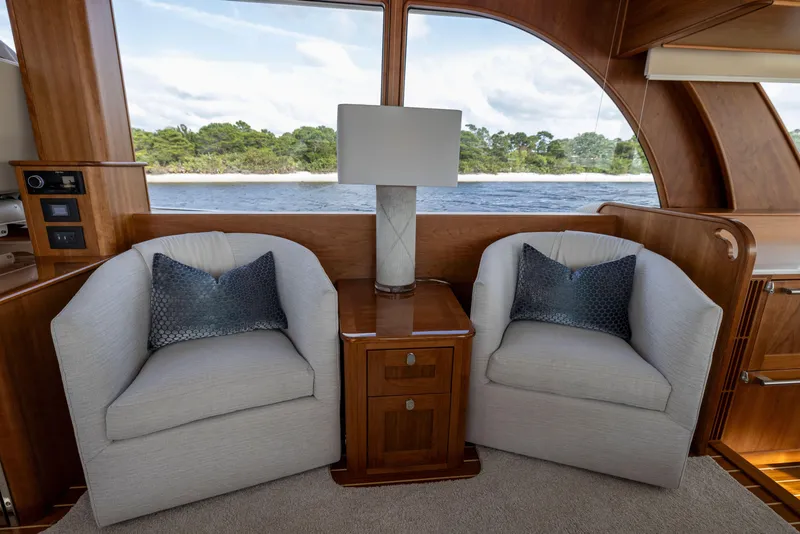 Slide: The Image of Interior of 2026 Sabre 58 Salon Express yacht with cozy seating and elegant decor. - 10