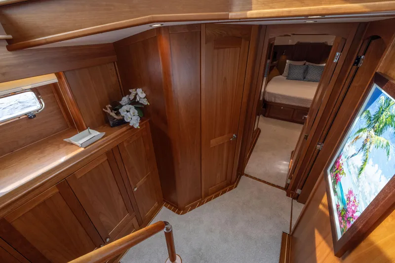 Slide: The Image of Luxurious interior of 2026 Sabre 58 Salon Express yacht with wood paneling and cozy bedroom. - 15