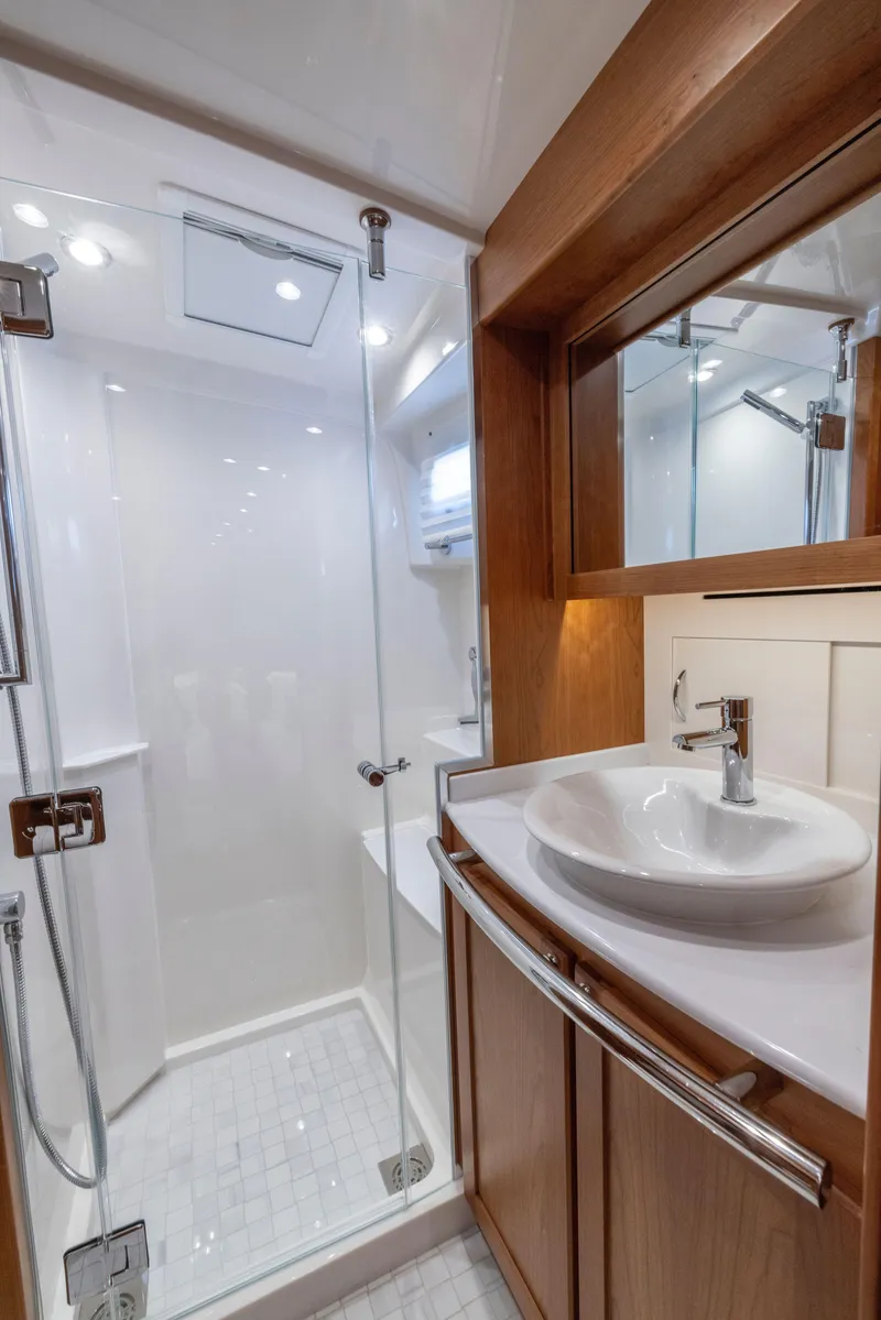 Slide: The Image of Luxurious bathroom in 2026 Sabre 58 Salon Express yacht with modern fixtures and glass shower. - 23