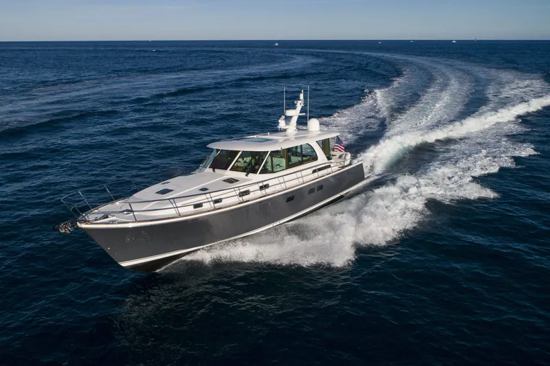Slide: The Image of 2026 Sabre 58 Salon Express yacht cruising on open sea. - 38