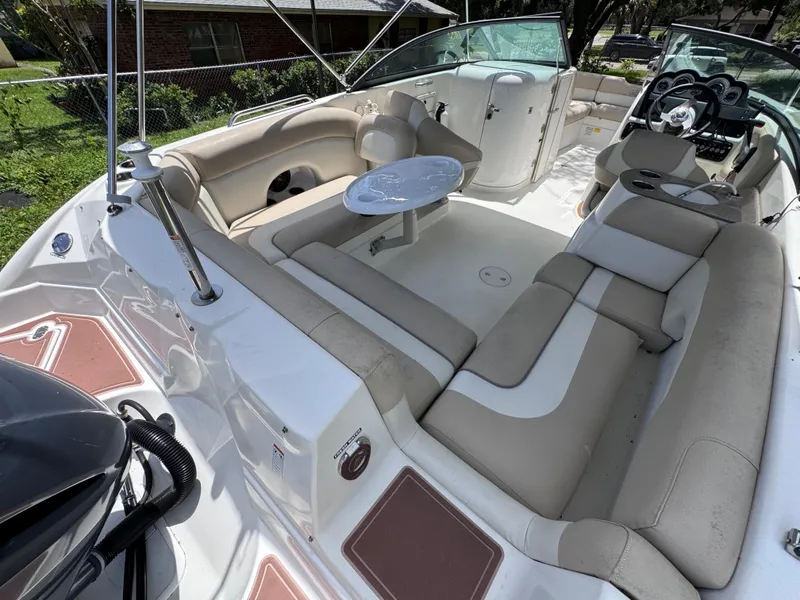 Slide: The Image of 2018 NauticStar DC 243 Sport Deck boat with spacious seating and modern interior design. - 23