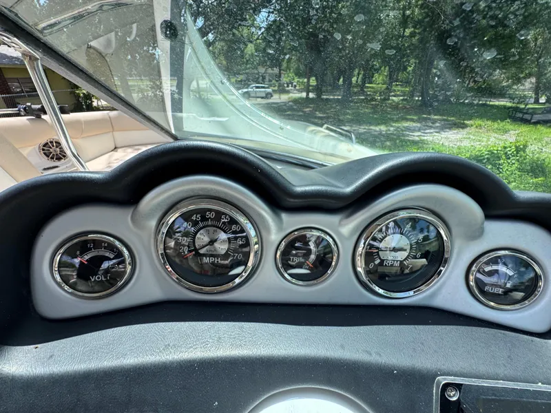 Slide: The Image of Dashboard of 2018 NauticStar DC 243 Sport Deck boat with gauges and controls. - 33
