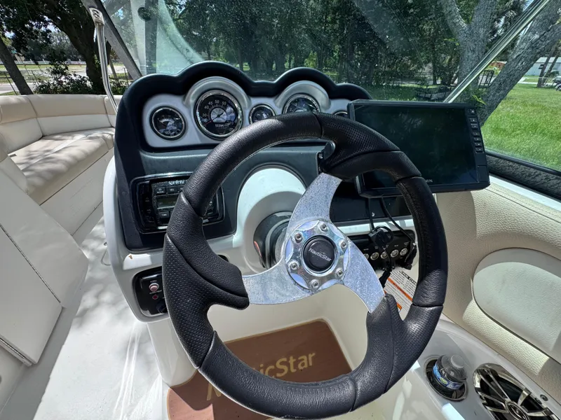 Slide: The Image of Steering wheel and dashboard of 2018 NauticStar DC 243 Sport Deck boat. - 42
