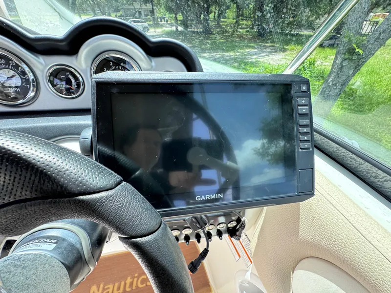 Slide: The Image of 2018 NauticStar DC 243 Sport Deck dashboard with Garmin navigation system. - 43
