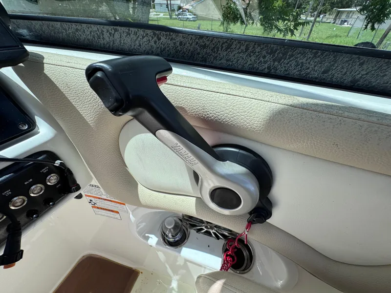 Slide: The Image of Throttle control of 2018 NauticStar DC 243 Sport Deck boat, interior view. - 44