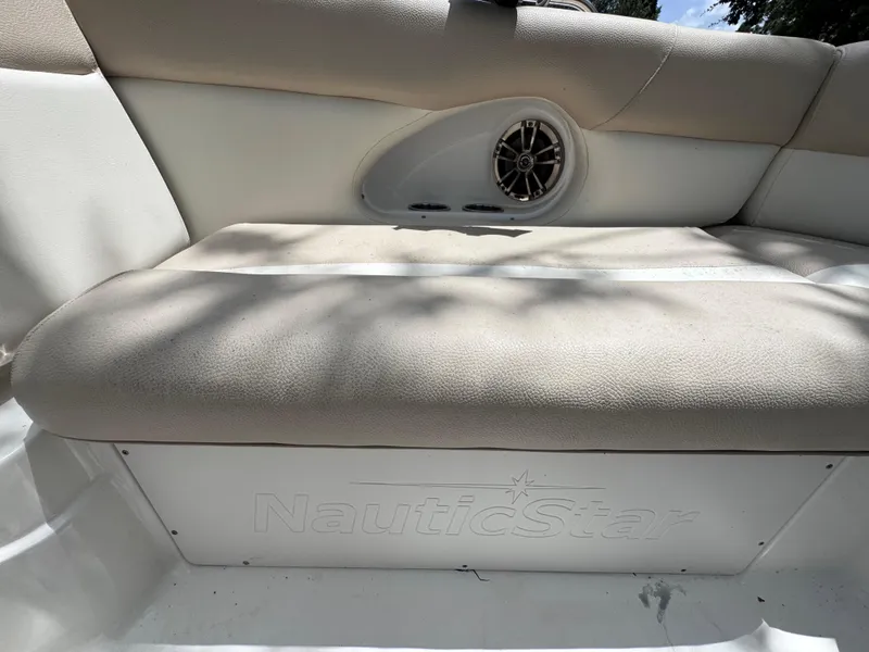Slide: The Image of 2018 NauticStar DC 243 Sport Deck boat seat with speaker detail. - 45