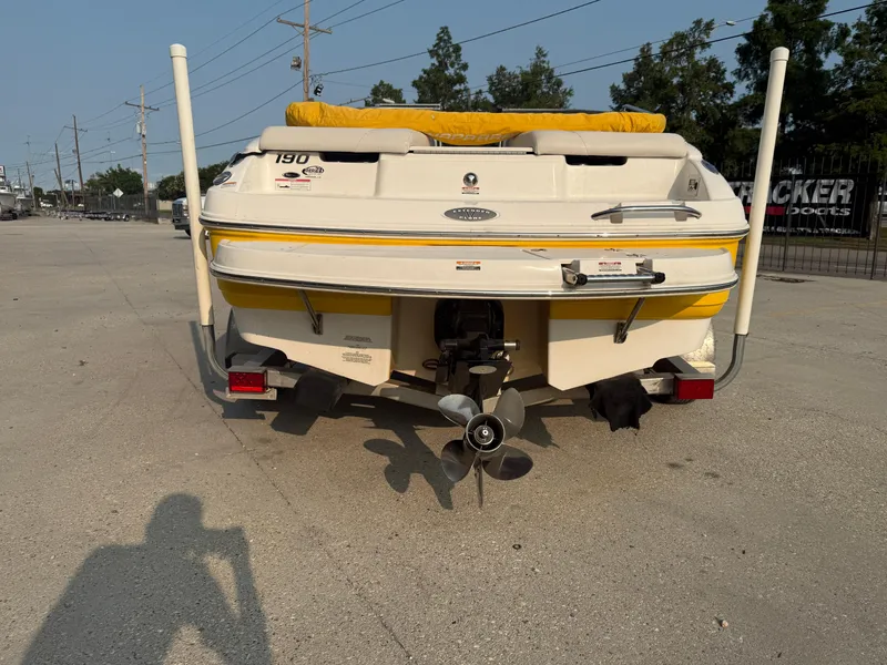 Slide: The Image of 2008 Chaparral SSi 190 boat rear view with yellow accents and propeller. - 13
