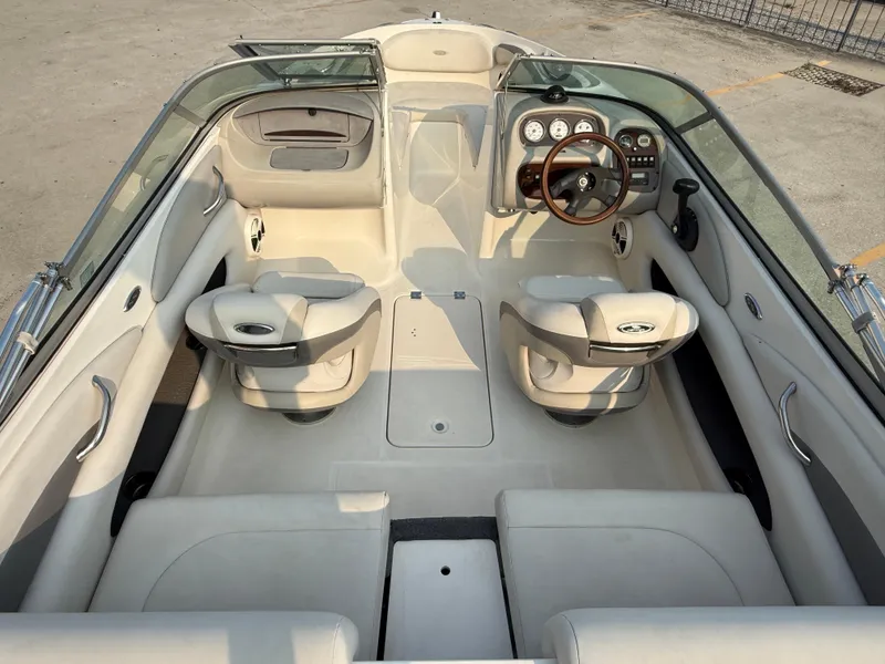 Slide: The Image of 2008 Chaparral SSi 190 boat interior with beige seating and dashboard. - 15