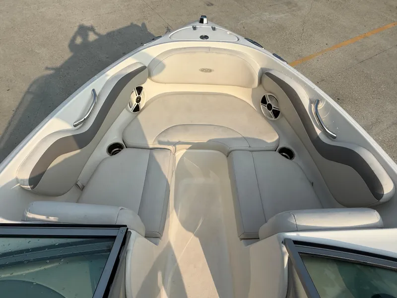 Slide: The Image of 2008 Chaparral SSi 190 boat interior with beige seating and cup holders. - 16