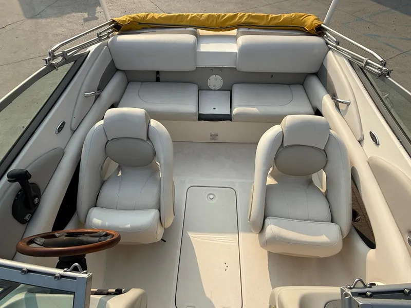 Slide: The Image of 2008 Chaparral SSi 190 boat interior with white seating and steering wheel. - 17