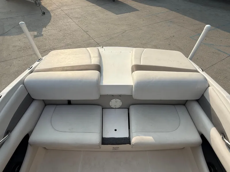Slide: The Image of 2008 Chaparral SSi 190 boat interior with cushioned seating and storage compartments. - 21