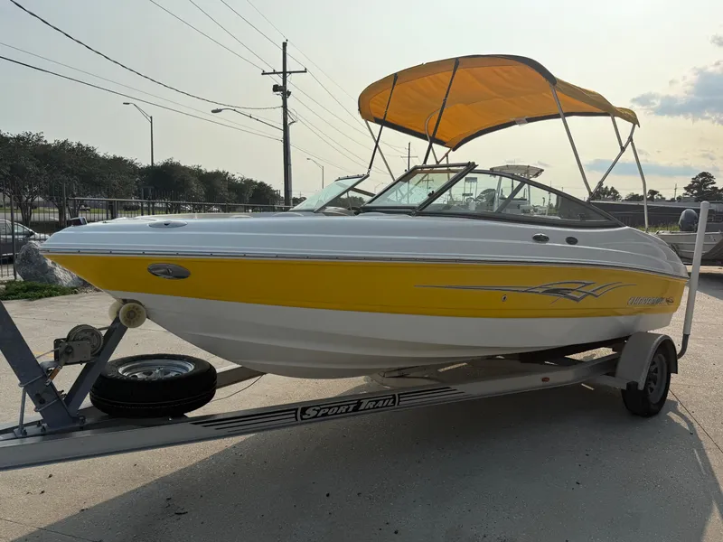 Slide: The Image of 2008 Chaparral SSi 190 boat with yellow hull and canopy on a trailer. - 4
