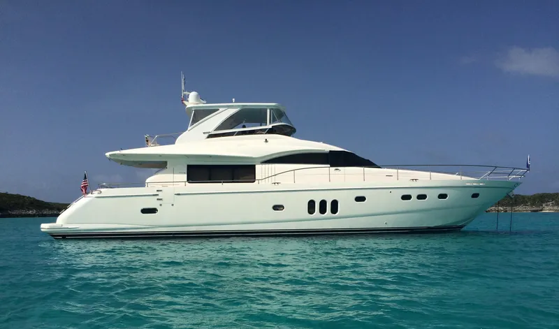 Slide: The Image of 2006 Viking Princess Sport Cruisers yacht on clear turquoise water. - 1