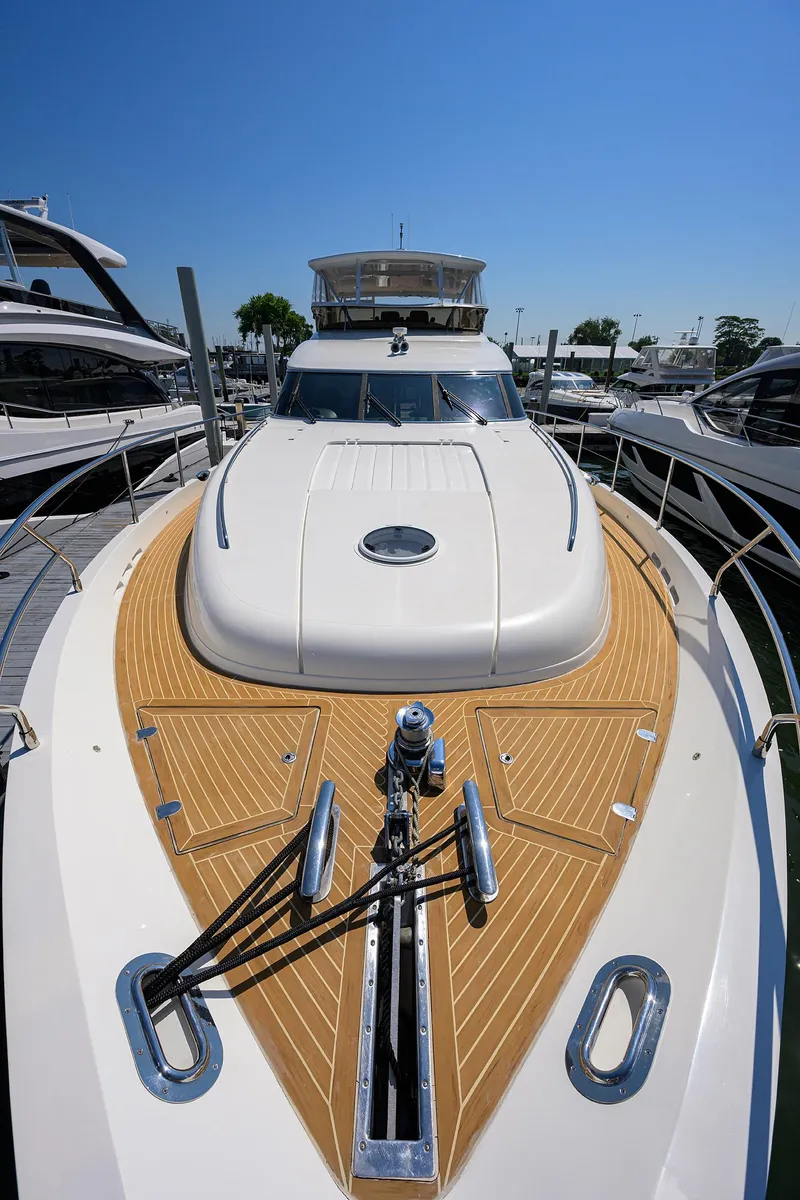 Slide: The Image of 2006 Viking Princess Sport Cruisers yacht docked under clear blue sky. - 10