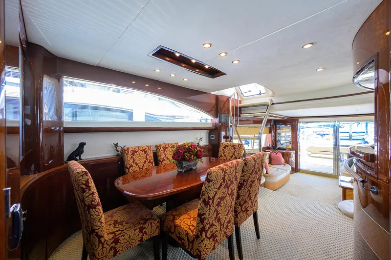 Slide: The Image of Luxurious 2006 Viking Princess Sport Cruisers yacht interior with elegant dining area and plush seating. - 13