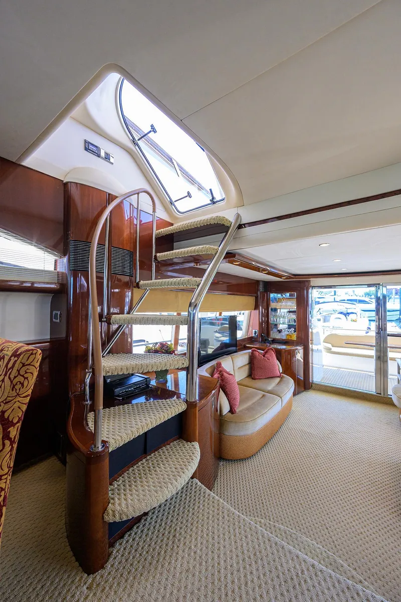 Slide: The Image of Luxurious 2006 Viking Princess Sport Cruisers interior with spiral staircase and elegant seating area. - 14