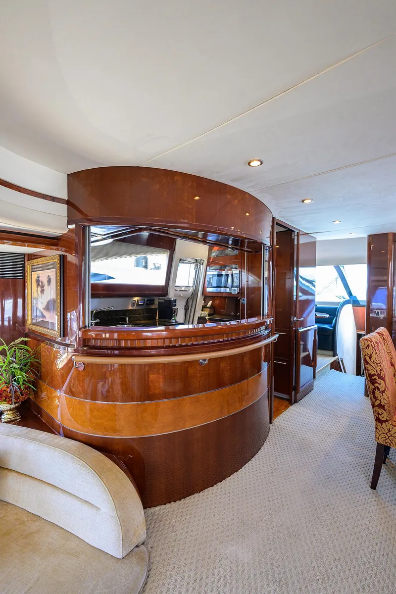 Slide: The Image of Luxurious 2006 Viking Princess Sport Cruisers yacht interior with elegant wood finishes and plush seating. - 17