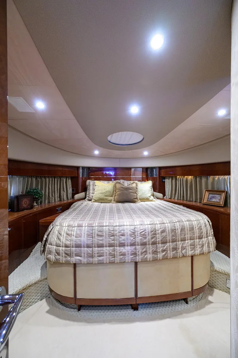 Slide: The Image of Luxurious bedroom interior of 2006 Viking Princess Sport Cruisers yacht with elegant bedding and lighting. - 24