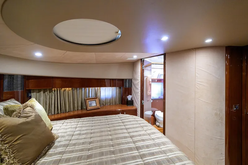 Slide: The Image of Luxurious 2006 Viking Princess Sport Cruisers cabin with elegant bedding and ensuite bathroom. - 26