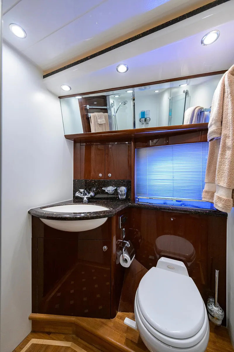 Slide: The Image of Luxurious 2006 Viking Princess Sport Cruisers yacht bathroom with modern fixtures and elegant wood finishes. - 28