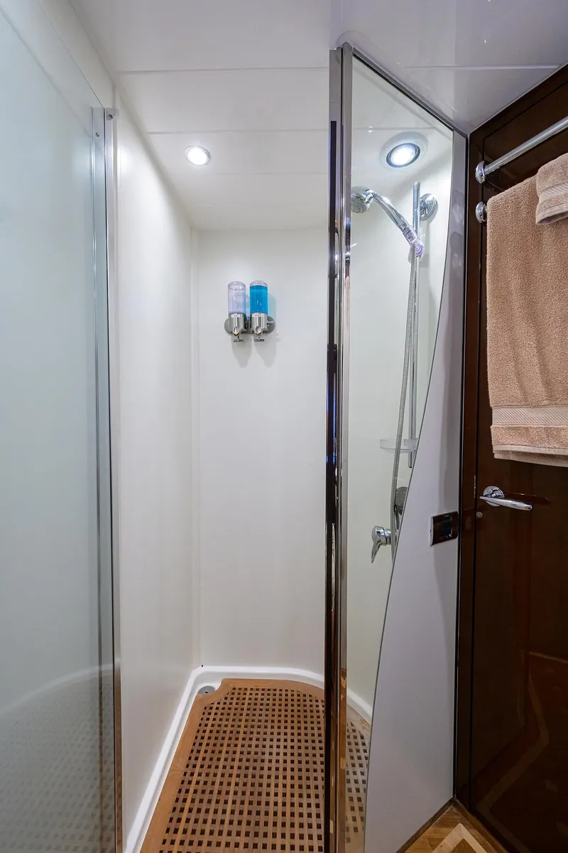 Slide: The Image of Shower area in 2006 Viking Princess Sport Cruisers yacht, featuring modern fixtures and wooden flooring. - 29