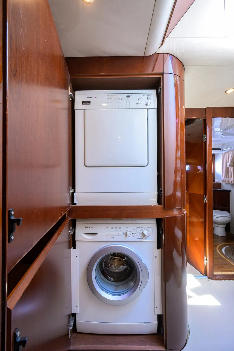 Slide: The Image of Stacked washer and dryer in 2006 Viking Princess Sport Cruisers yacht interior. - 30