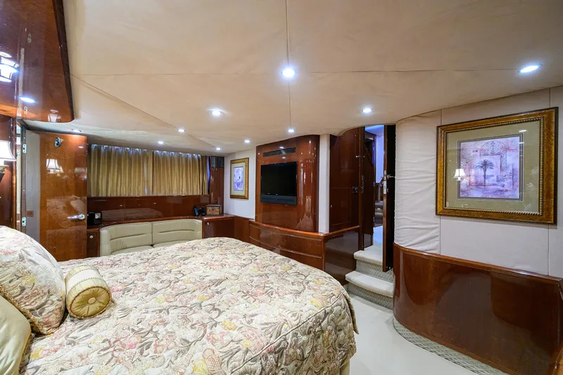 Slide: The Image of Luxurious 2006 Viking Princess Sport Cruisers yacht bedroom with elegant decor and ambient lighting. - 32