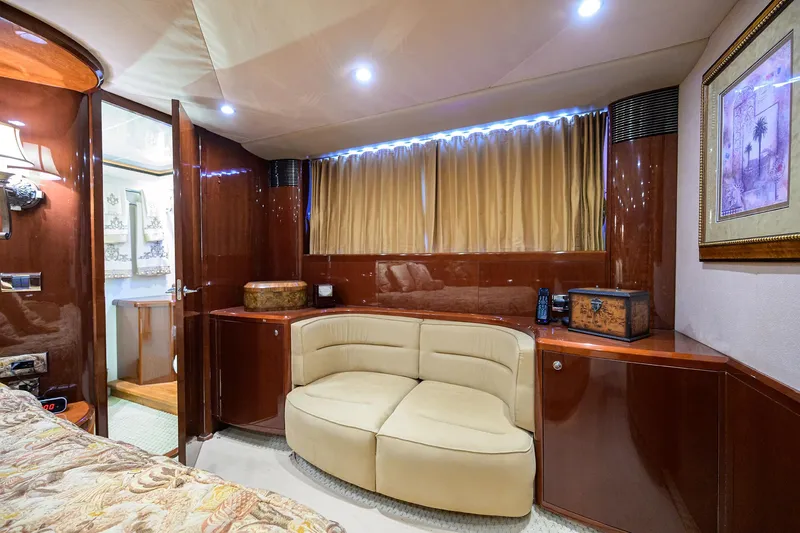 Slide: The Image of Luxurious interior of 2006 Viking Princess Sport Cruisers with elegant seating and wood finishes. - 35