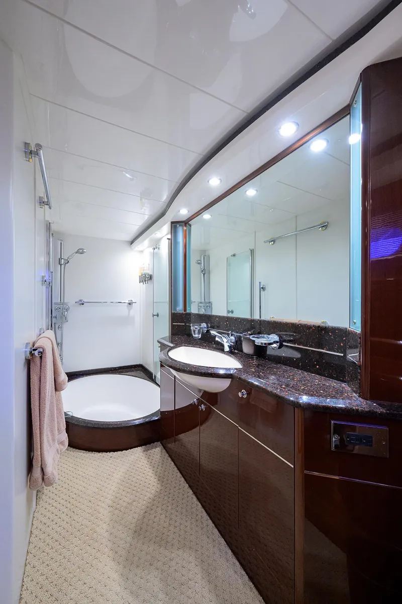 Slide: The Image of Luxurious bathroom in 2006 Viking Princess Sport Cruisers yacht, featuring elegant fixtures and spacious design. - 37