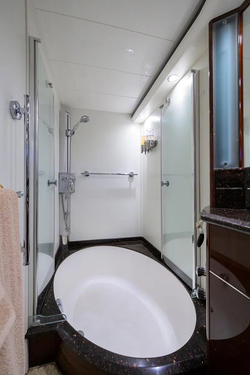 Slide: The Image of Luxurious bathroom in 2006 Viking Princess Sport Cruisers yacht with modern fixtures and oval bathtub. - 38