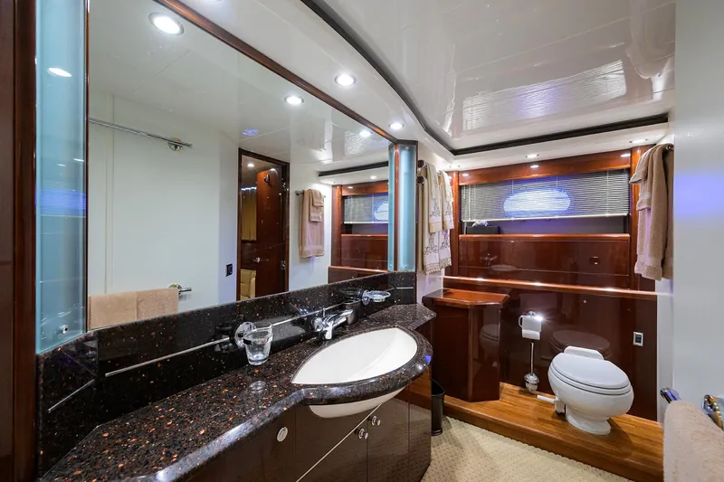 Slide: The Image of Luxurious bathroom in 2006 Viking Princess Sport Cruisers yacht with elegant fixtures and wood accents. - 39