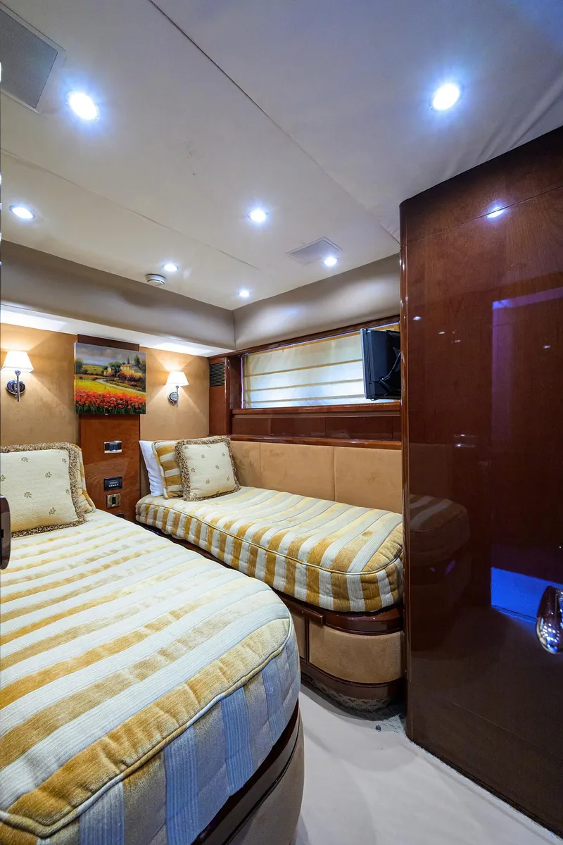 Slide: The Image of Luxurious 2006 Viking Princess Sport Cruisers cabin with twin beds and elegant lighting. - 40