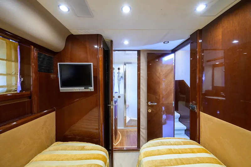 Slide: The Image of Luxurious 2006 Viking Princess Sport Cruisers cabin interior with twin beds and TV. - 41