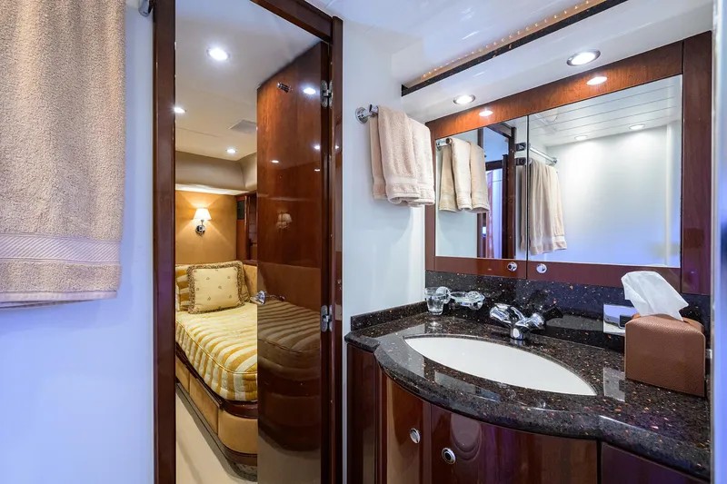 Slide: The Image of Luxurious 2006 Viking Princess Sport Cruisers bathroom with elegant wood and granite finishes. - 43