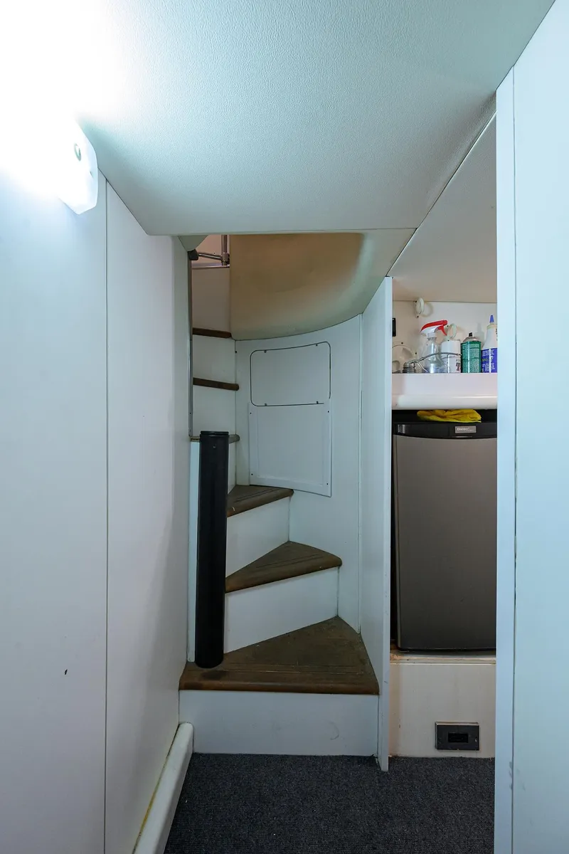 Slide: The Image of Staircase and kitchenette area inside 2006 Viking Princess Sport Cruisers yacht. - 44