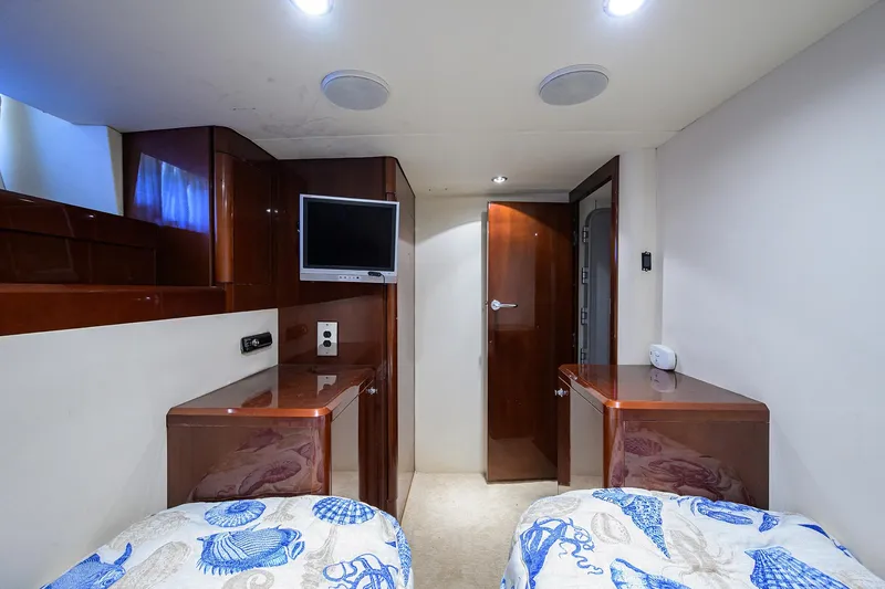 Slide: The Image of Luxurious 2006 Viking Princess Sport Cruisers cabin with twin beds and elegant wood finish. - 46