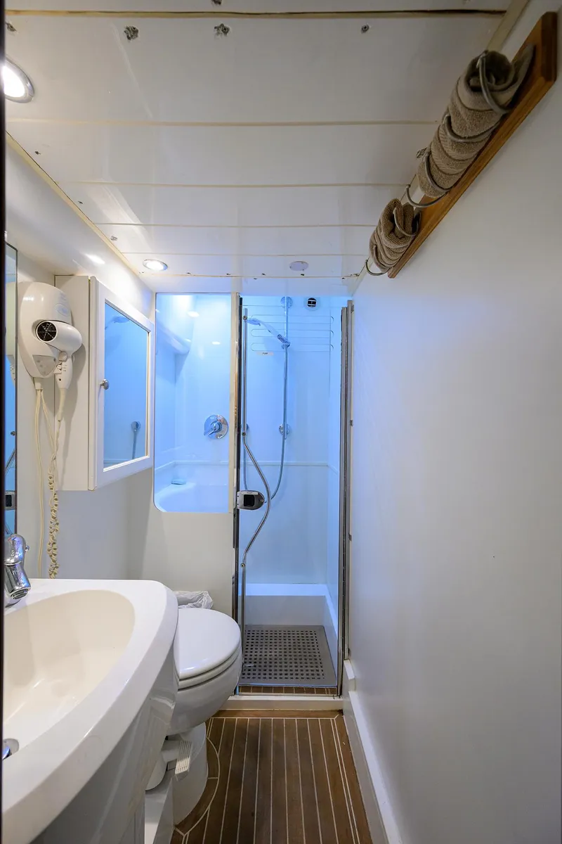Slide: The Image of Bathroom interior of 2006 Viking Princess Sport Cruisers yacht, featuring shower and sink. - 47