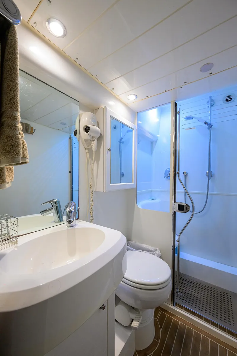 Slide: The Image of Luxurious 2006 Viking Princess Sport Cruisers bathroom with modern fixtures and shower. - 48