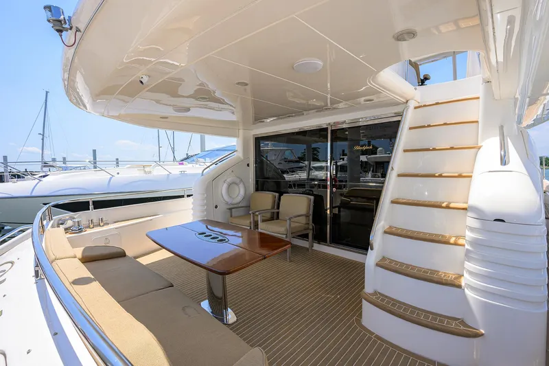 Slide: The Image of Luxurious 2006 Viking Princess Sport Cruiser yacht deck with seating and stairs. - 7