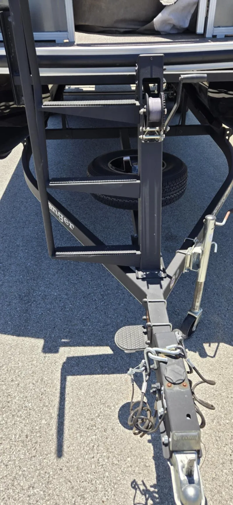 Slide: The Image of Trailer hitch of 2020 Ranger Reata 220FC on asphalt surface. - 17