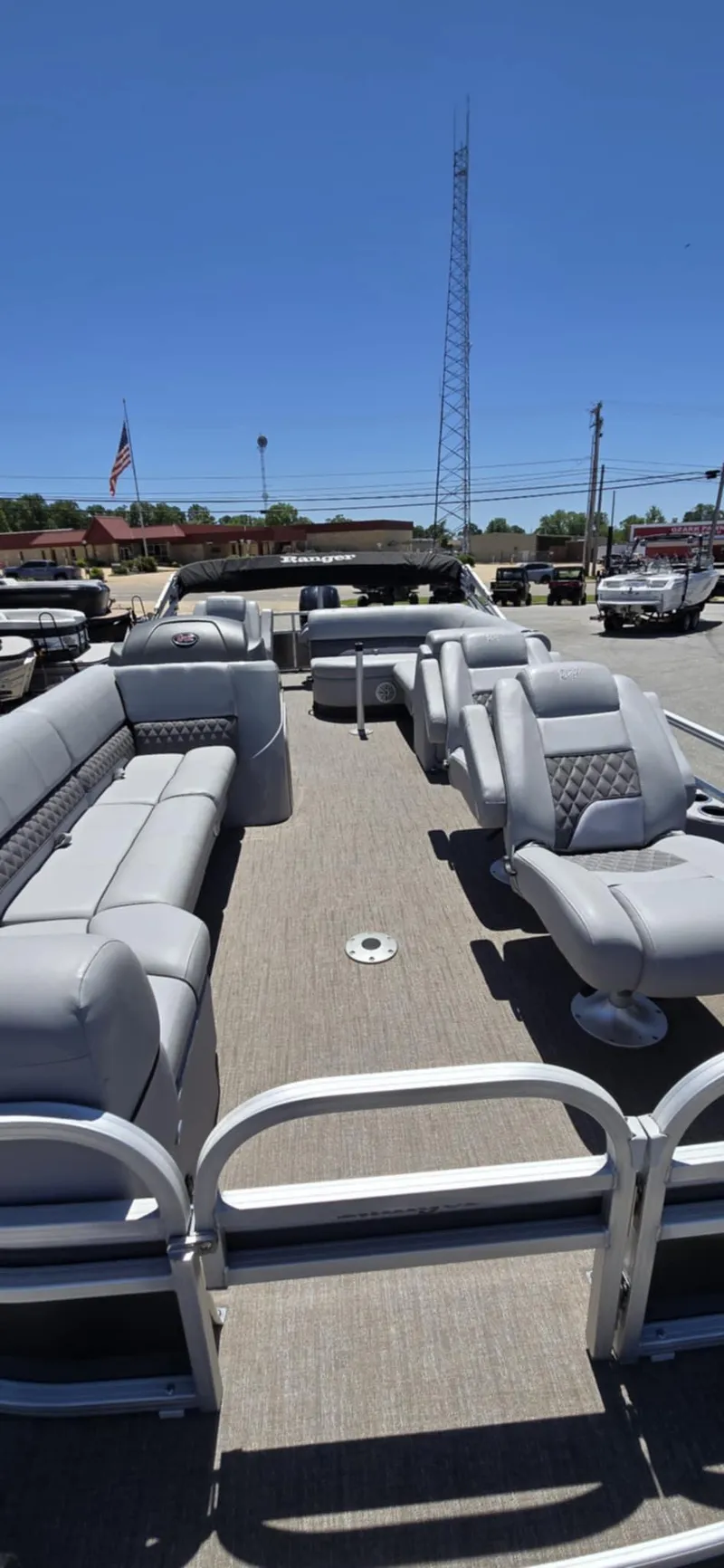 Slide: The Image of 2020 Ranger Reata 220FC pontoon boat with spacious seating and modern design. - 18