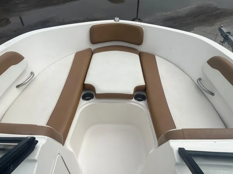 Slide: The Image of 2021 Bayliner VR5 Bowrider OB interior with tan and white seating. - 6